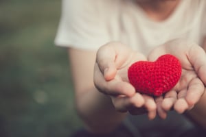 Giving-Tuesday-Woman-Holding-Heart